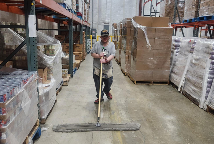 Individual with disabilities working in a warehouse