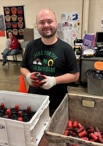 Individual at Marimor Industries packaging items